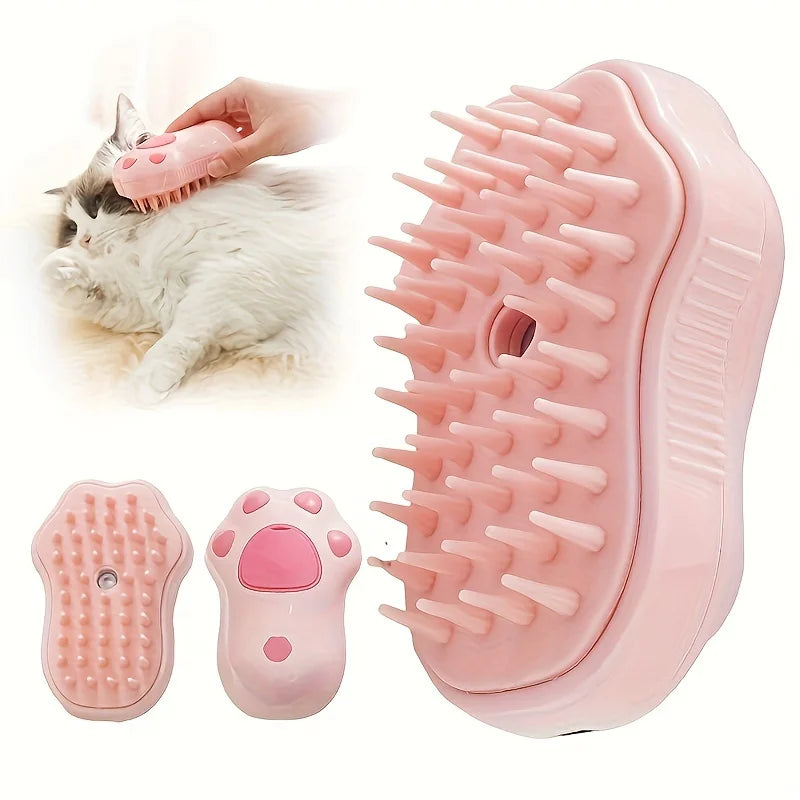 Pink 3-in-1 electric steam pet grooming brush for cats and dogs, featuring silicone bristles for massage and hair removal.