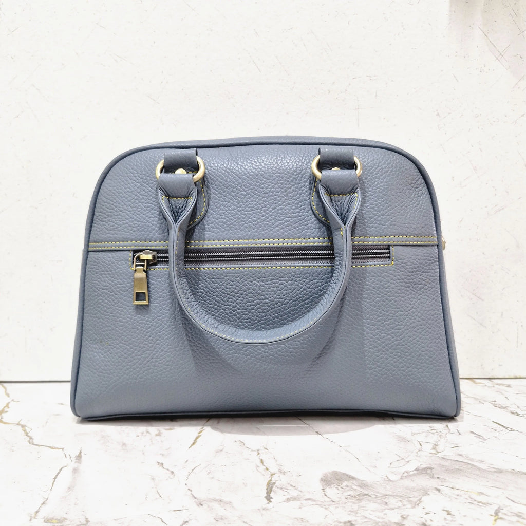 Blue pebble-grain genuine leather designer mini tote bag with gold-tone hardware and zippered exterior pocket.