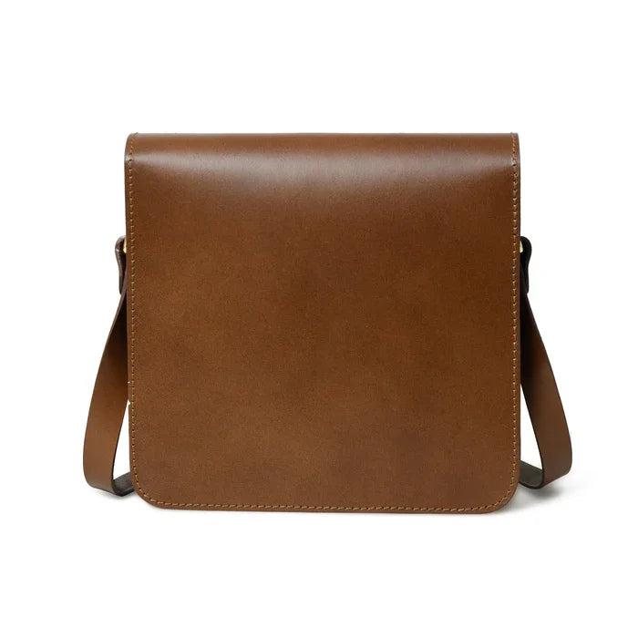 Minimalist brown leather crossbody designer handbag with a sleek, square flap silhouette and adjustable shoulder strap.