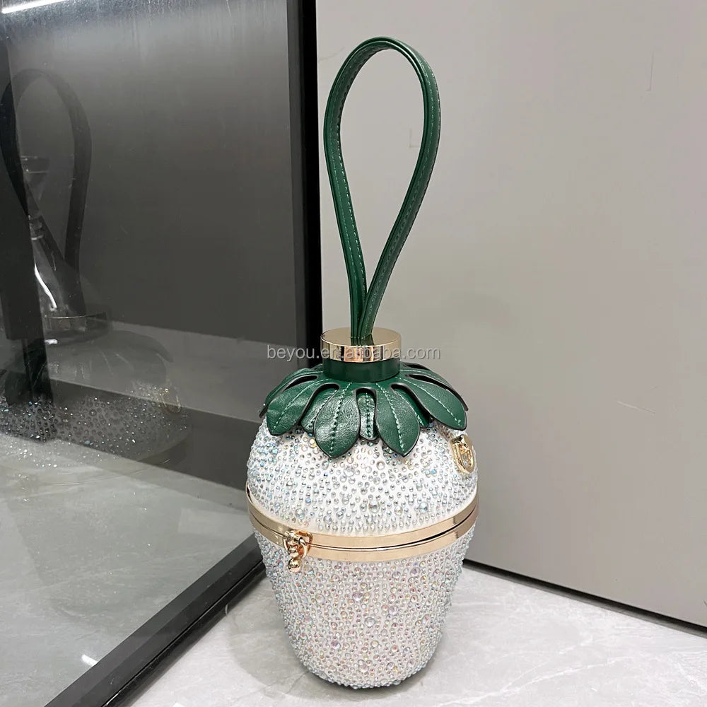 Luxury rhinestone strawberry evening clutch with green leather handle, perfect for weddings and banquets.