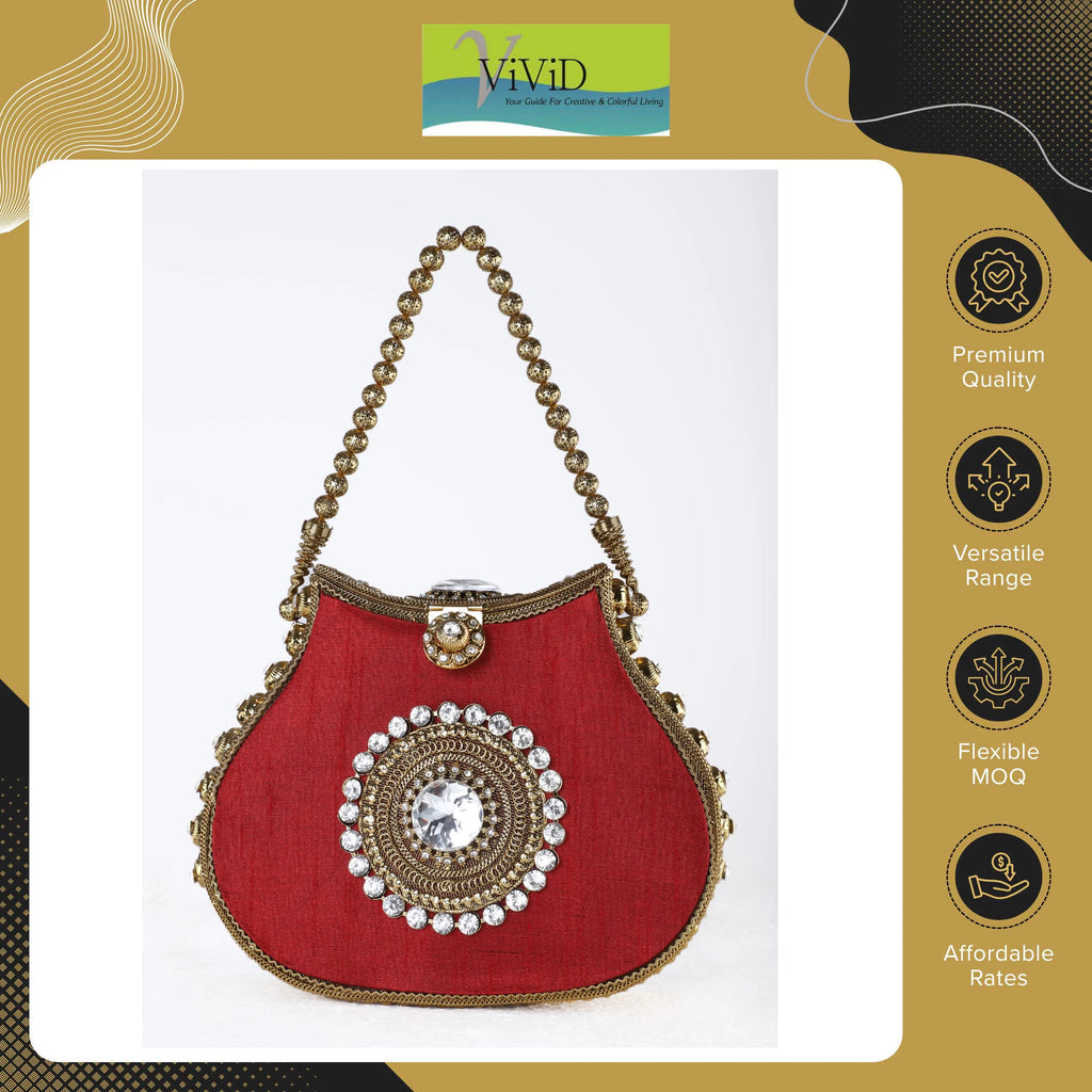 Red silk designer handbag with gold metal beading, rhinestone center, and kiss lock closure.