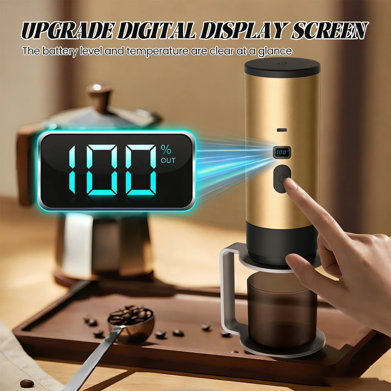 Portable gold coffee maker with digital battery display screen, charging port, and small cup on a wooden tray.