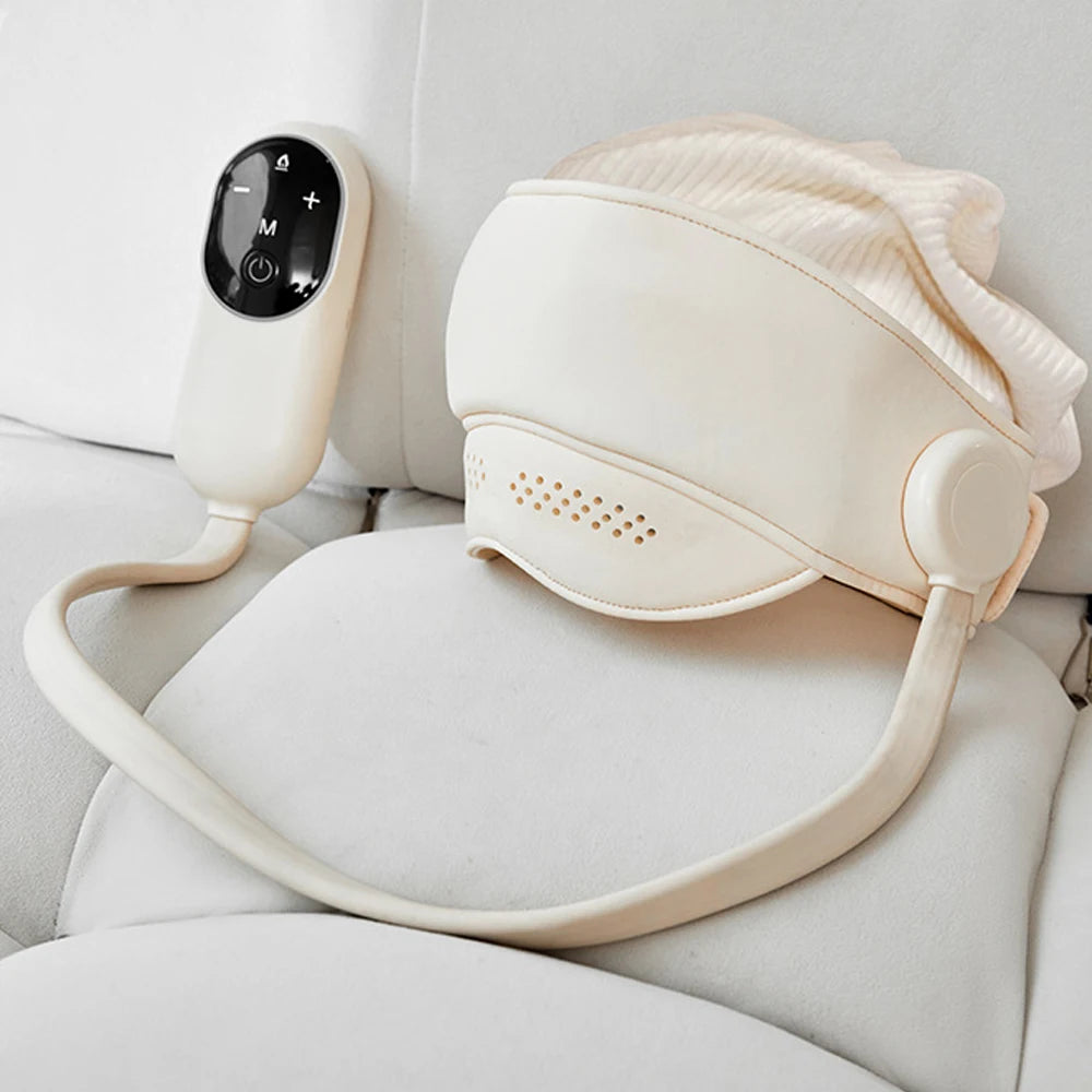 Beige electric head and eye massager with remote, 4 massage modes, 3 heat settings, and soft gasbag wrap design.