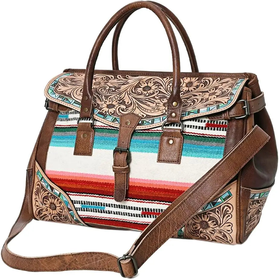 Handwoven western duffel bag with floral tooled leather, vibrant striped fabric, top handles, and shoulder strap. Trunk.