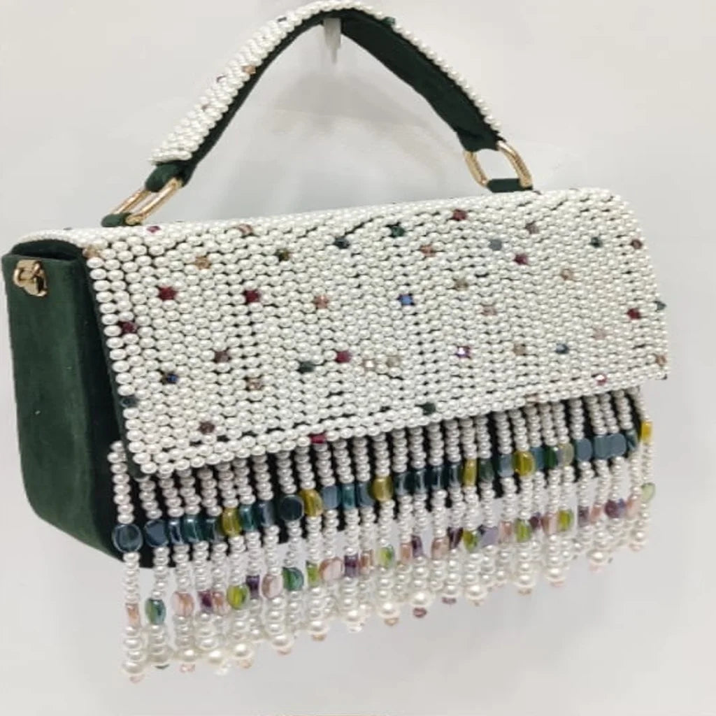 Dark green velvet evening clutch with white pearl beading, crystal accents, and a colorful beaded fringe tassel handle.
