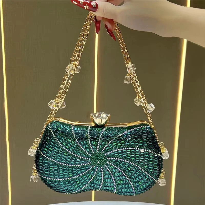 Green crystal-embellished designer clutch with gold chain, glass bead accents, and a jewel clasp closure.