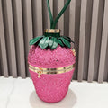 Pink rhinestone strawberry designer clutch with gold hardware, green leather leaves, and handle for evening banquets.