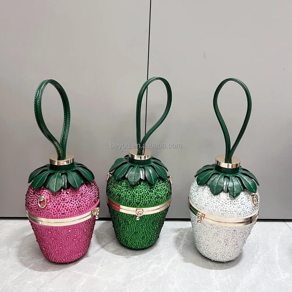 Pink, green, and white rhinestone strawberry designer handbags with green leather wristlet handles for weddings.
