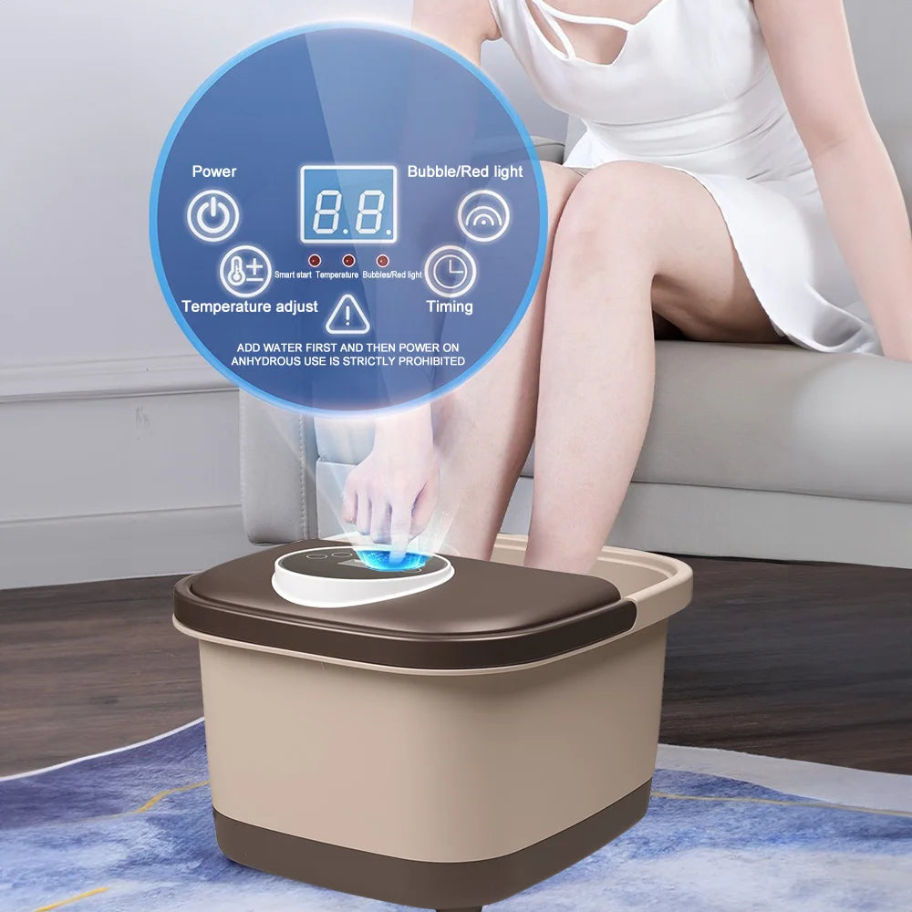 A person using a beige, square automatic massage foot spa with a brown lid and a digital touch-control interface.