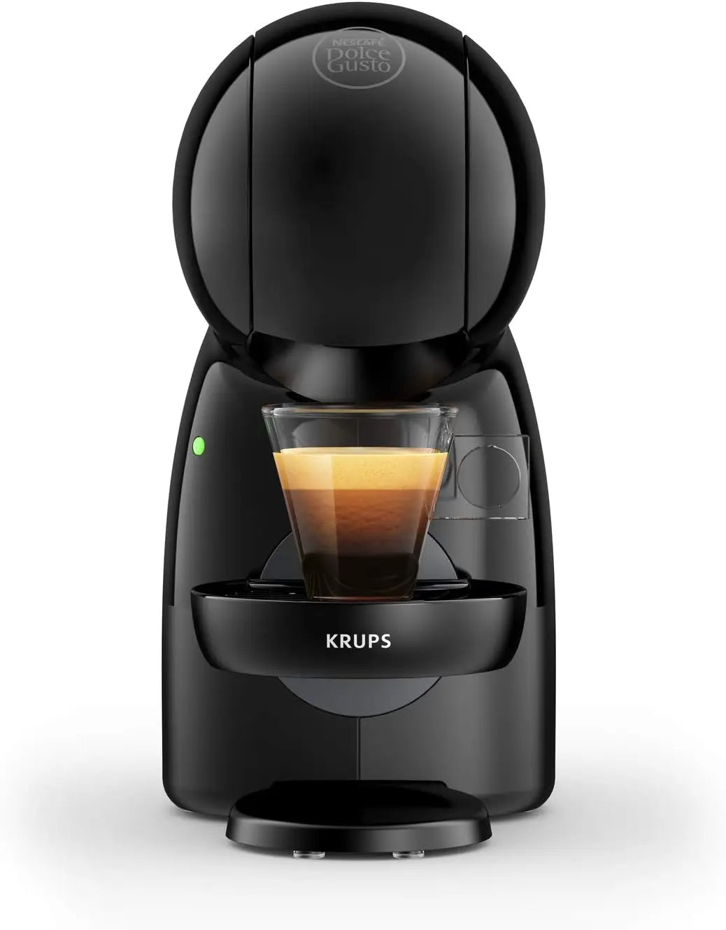 Krups Nescafe Dolce Gusto capsule coffee machine in black with a glass of freshly brewed espresso.
