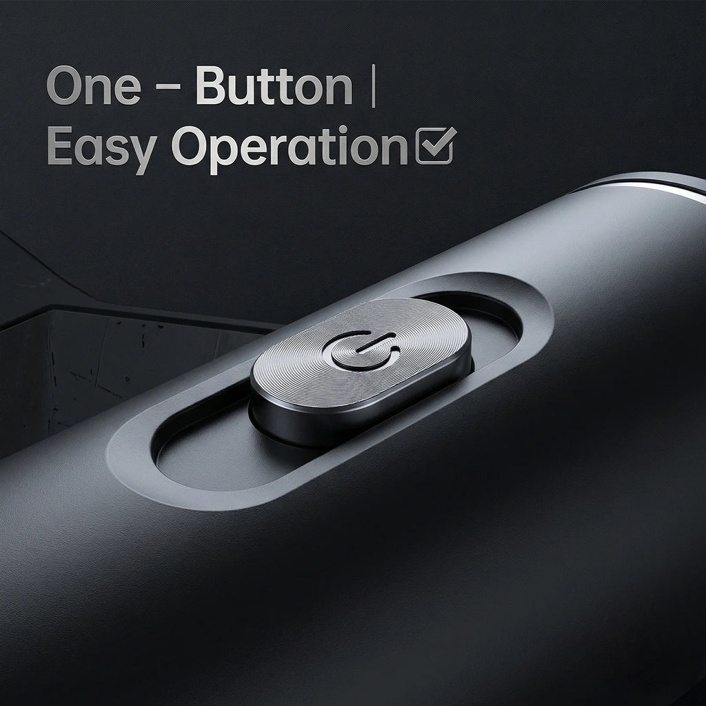 Close-up of a matte black portable coffee maker showing the textured metal power button and one-button operation.