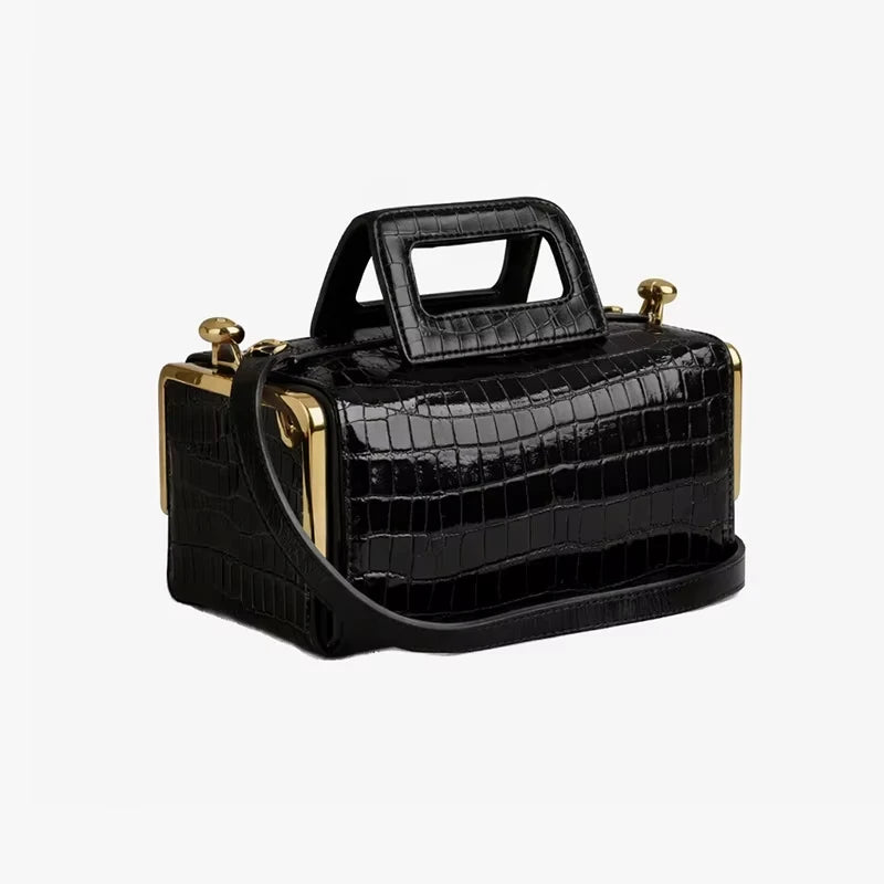 Black crocodile-embossed PU designer handbag with gold-tone hardware, structured rectangular frame, and top handle.