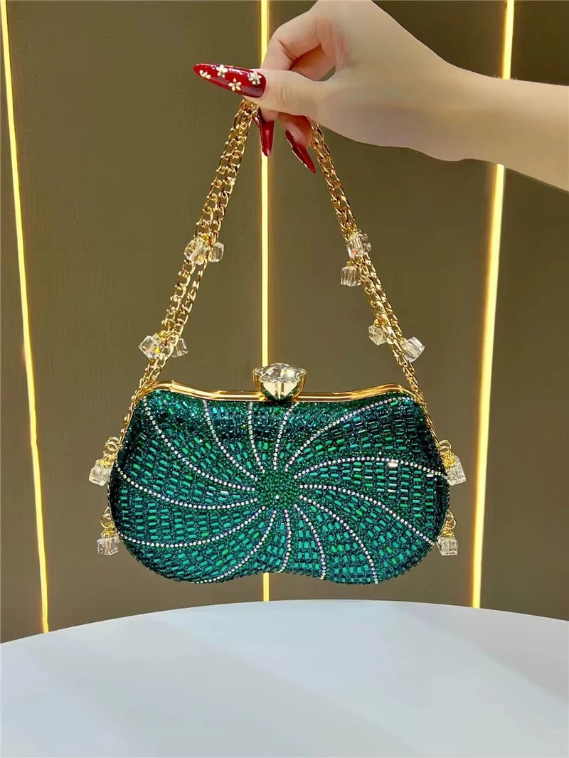 Green crystal evening clutch, designer handbag with gold chain strap, spiral rhinestone pattern, and jeweled clasp.