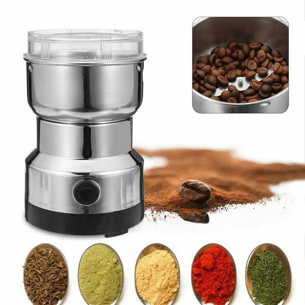 Stainless steel electric coffee bean and spice grinder with clear lid, silver base, and sharp metal blades.