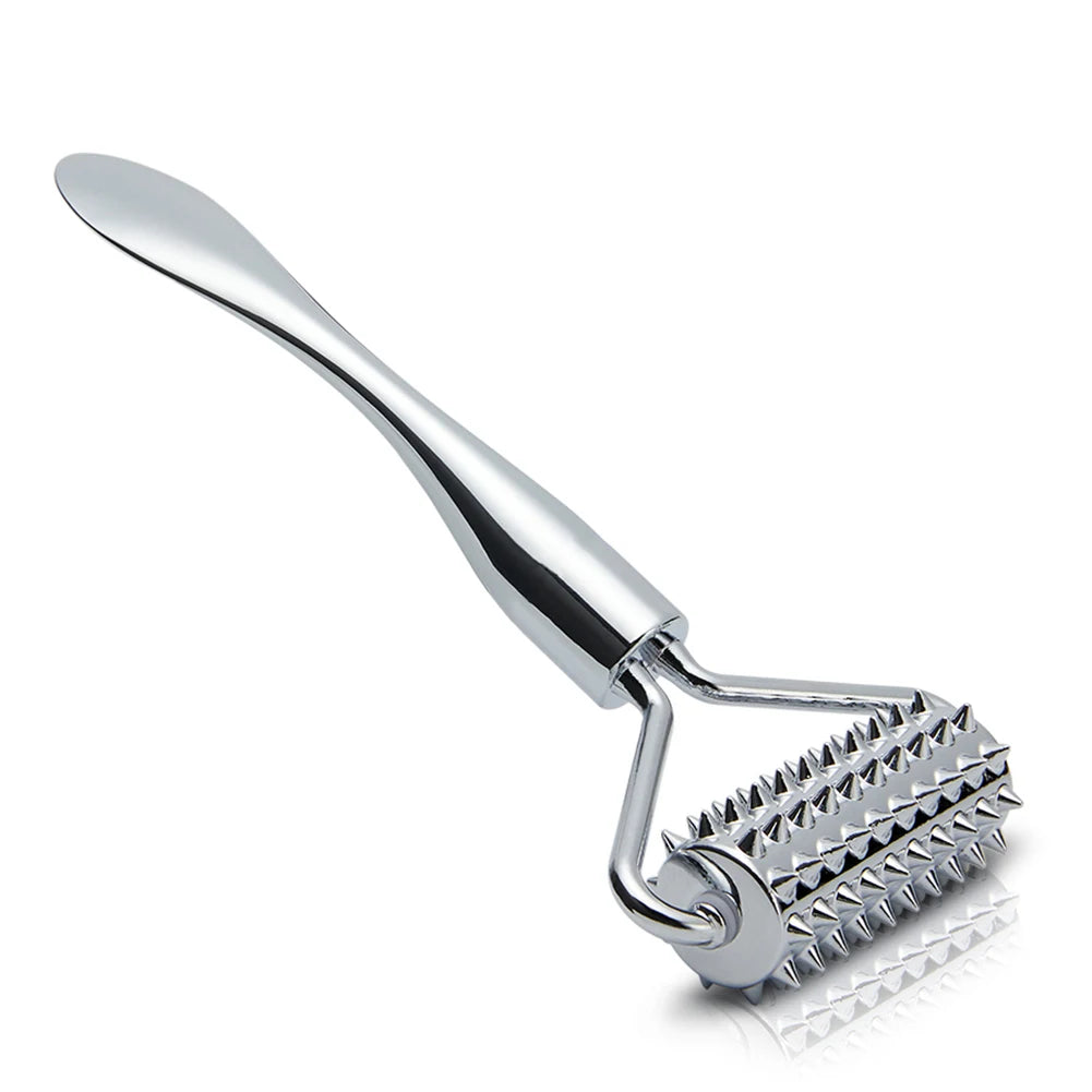 Silver zinc alloy facial massager with a spiky roller head and a smooth spatula handle against a white background.