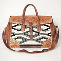 Hand-tooled brown leather and black-and-white Aztec saddle blanket trunk bag with bohemian floral accents.