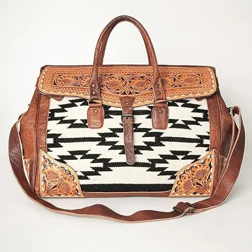 Hand-tooled brown leather and black-and-white Aztec saddle blanket trunk bag with bohemian floral accents.