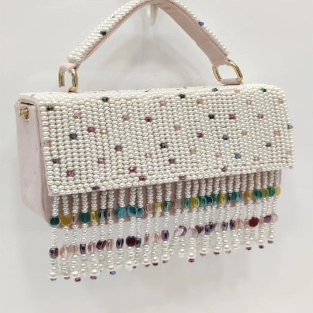 Luxury pearl beaded handbag with colorful crystal fringe, gold hardware, and top handle for elegant wedding evening wear.