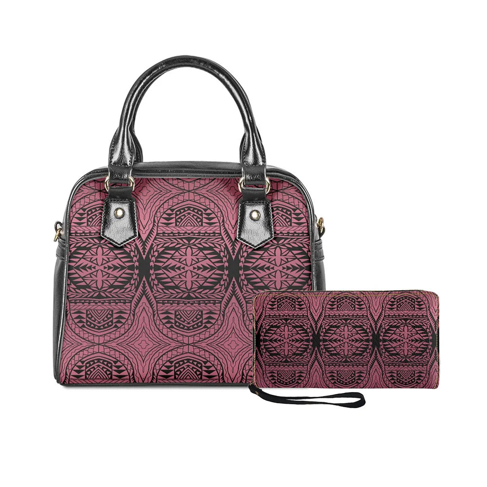 Two-piece handbag set featuring pink and black Polynesian tribal print with matching wristlet wallet and black handles.