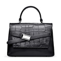 Black genuine leather designer handbag with crocodile texture, top handle, and silver buckle strap detail.