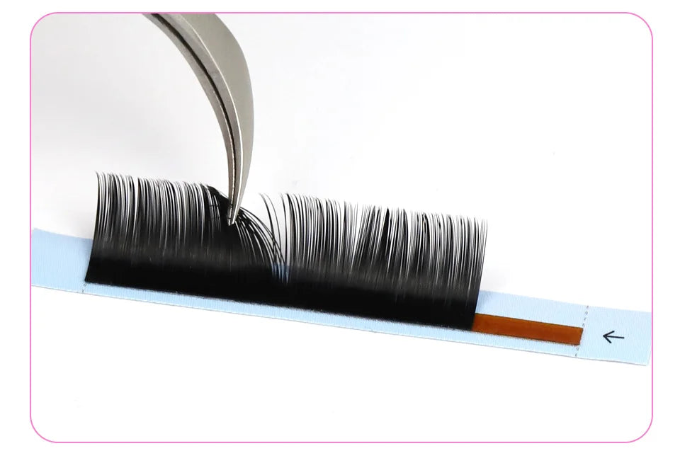 Tweezers lifting a black, 0.03mm handmade Russian volume silk eyelash fan from a light blue adhesive strip.
