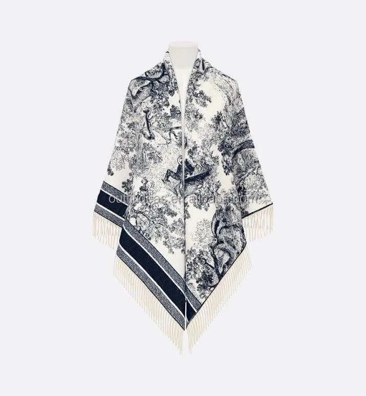 Luxury navy and white toile de Jouy print silk shawl with fringed hem and striped border. Elegant draped scarf wrap.