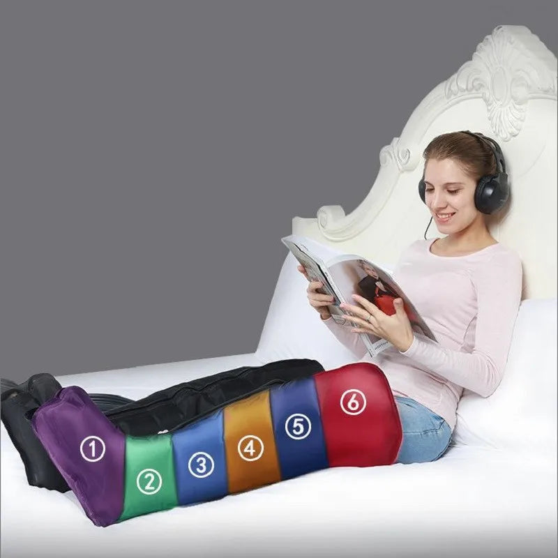 Woman in bed using black leg compression boots with six numbered, multi-colored sections for massage therapy.