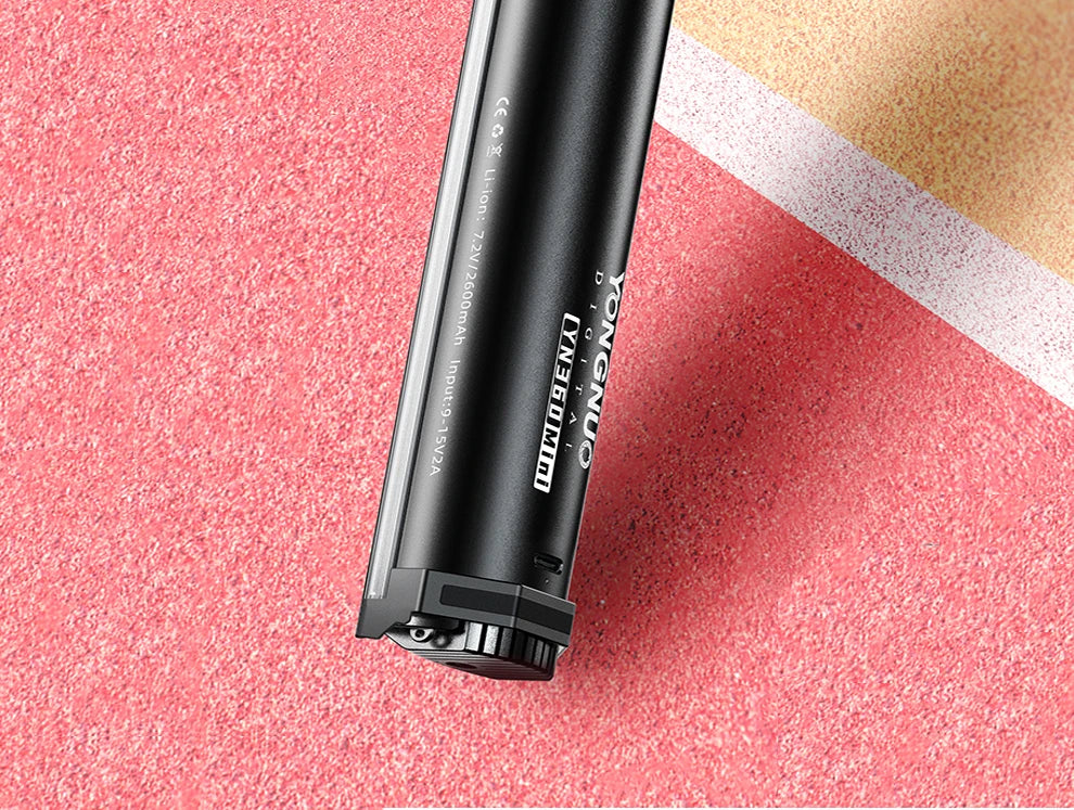 YN360 Mini LED light wand, black cylindrical metal casing, compact portable design for handheld photography lighting.