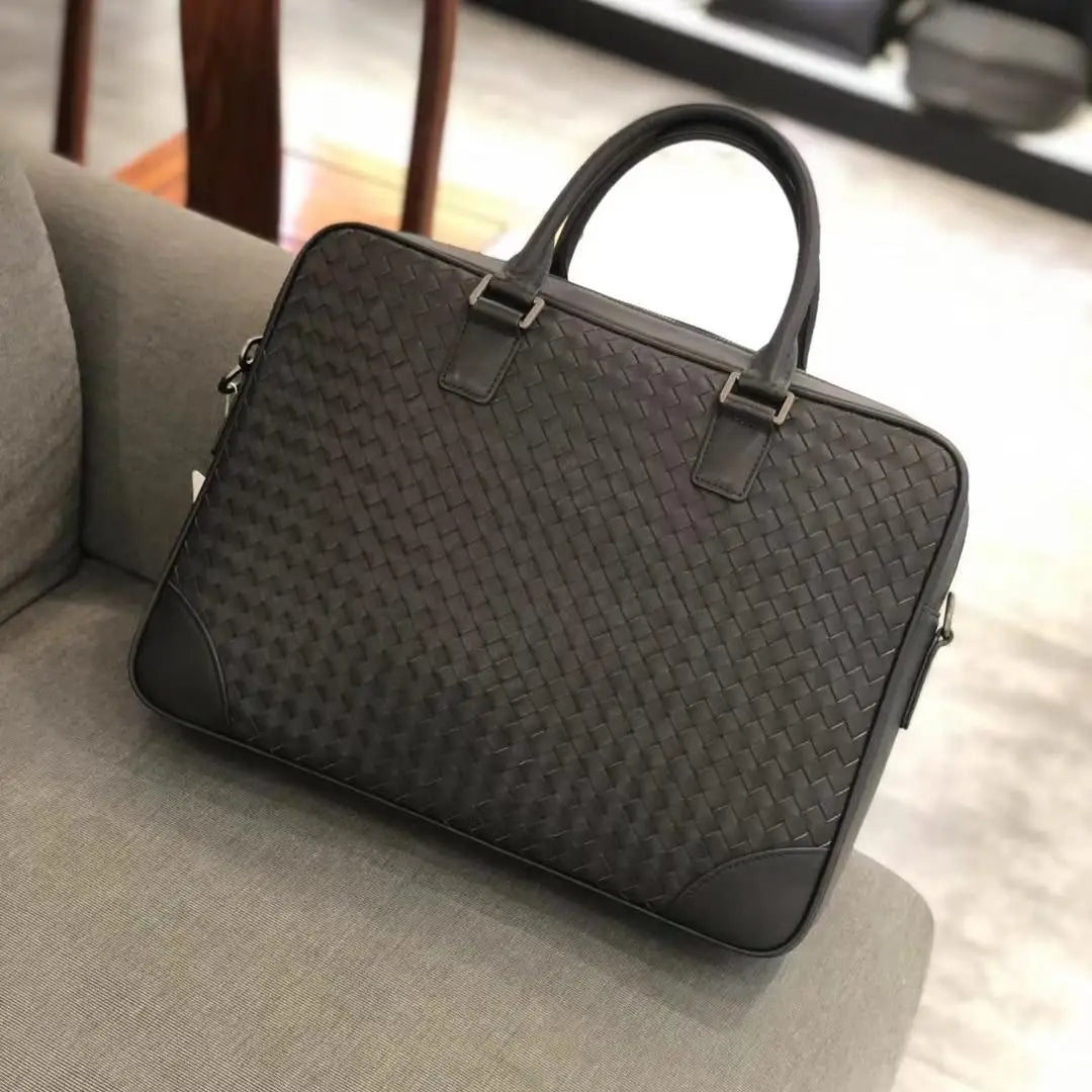 Luxury dark brown hand-woven leather 14-inch executive laptop briefcase for men with structured top handles.