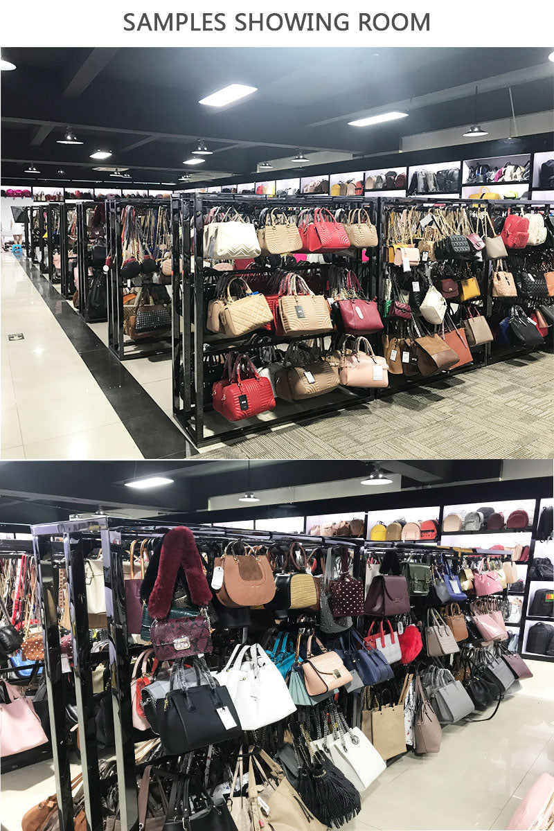 Showroom display of LOVEVOOK designer PU leather tote bags and elegant shoulder handbags in various colors and styles.