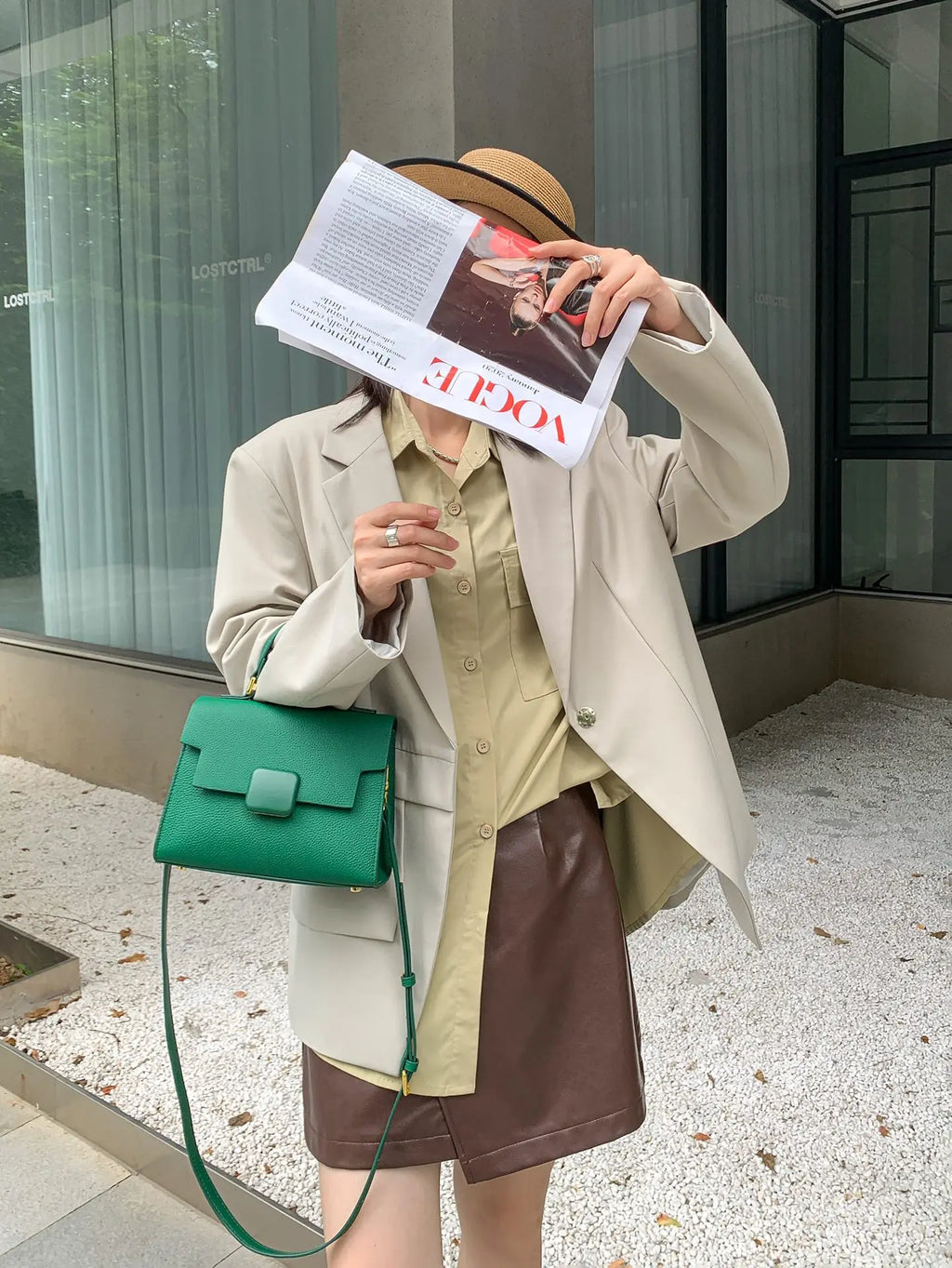 Green genuine leather designer handbag, structured shoulder tote with flap closure and gold-tone hardware.