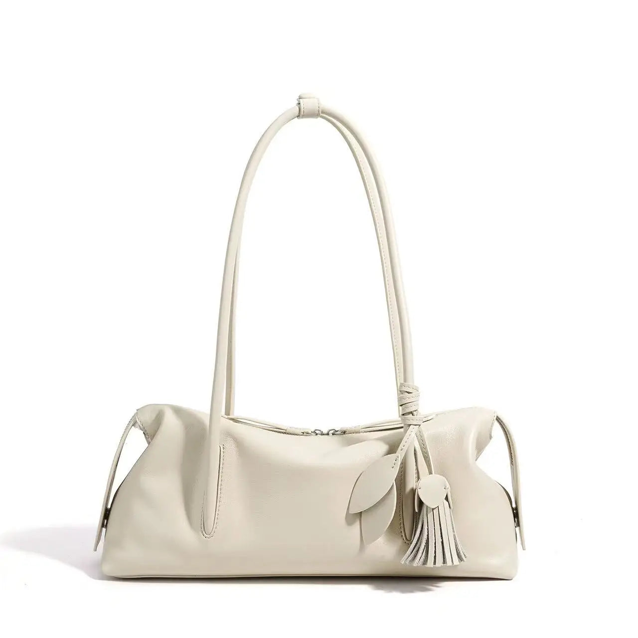Off-white luxury cowhide leather shoulder bag, trunk-style silhouette with leaf charm tassel and zipper closure.