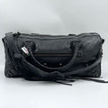 Second-hand black genuine leather designer tote with tassel, braided handles, and unique pillow-shaped silhouette.