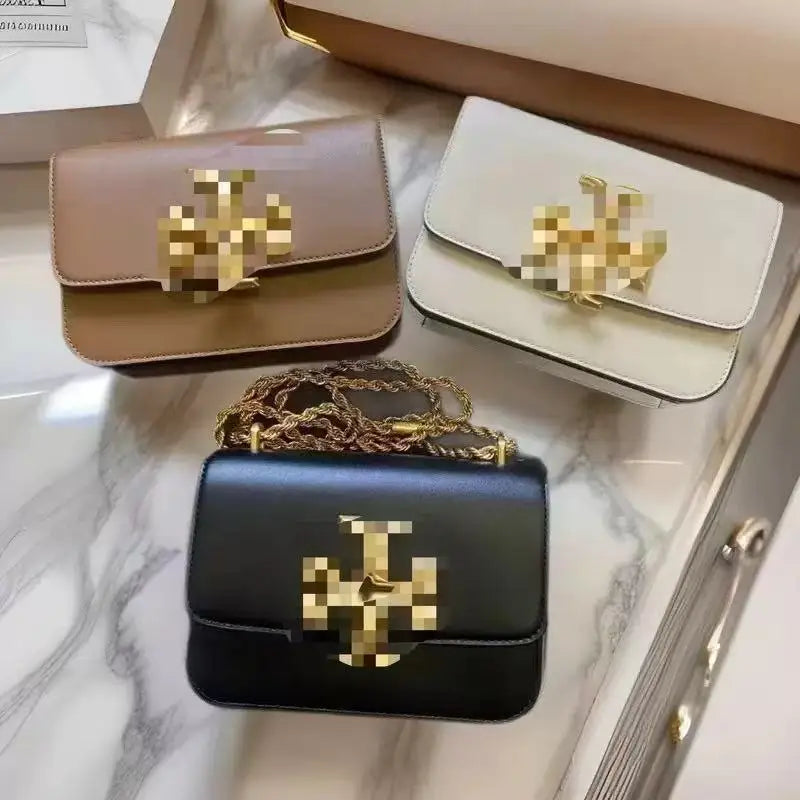 Zhenwo mini trunk crossbody bags in black, white, and brown leather with gold metal logo and chain shoulder strap.