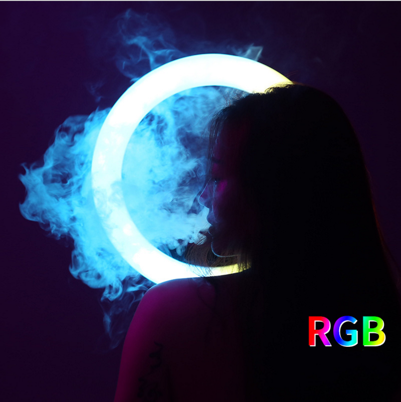 RGB ring light glowing bright blue behind a person, creating a circular halo effect with surrounding smoke.