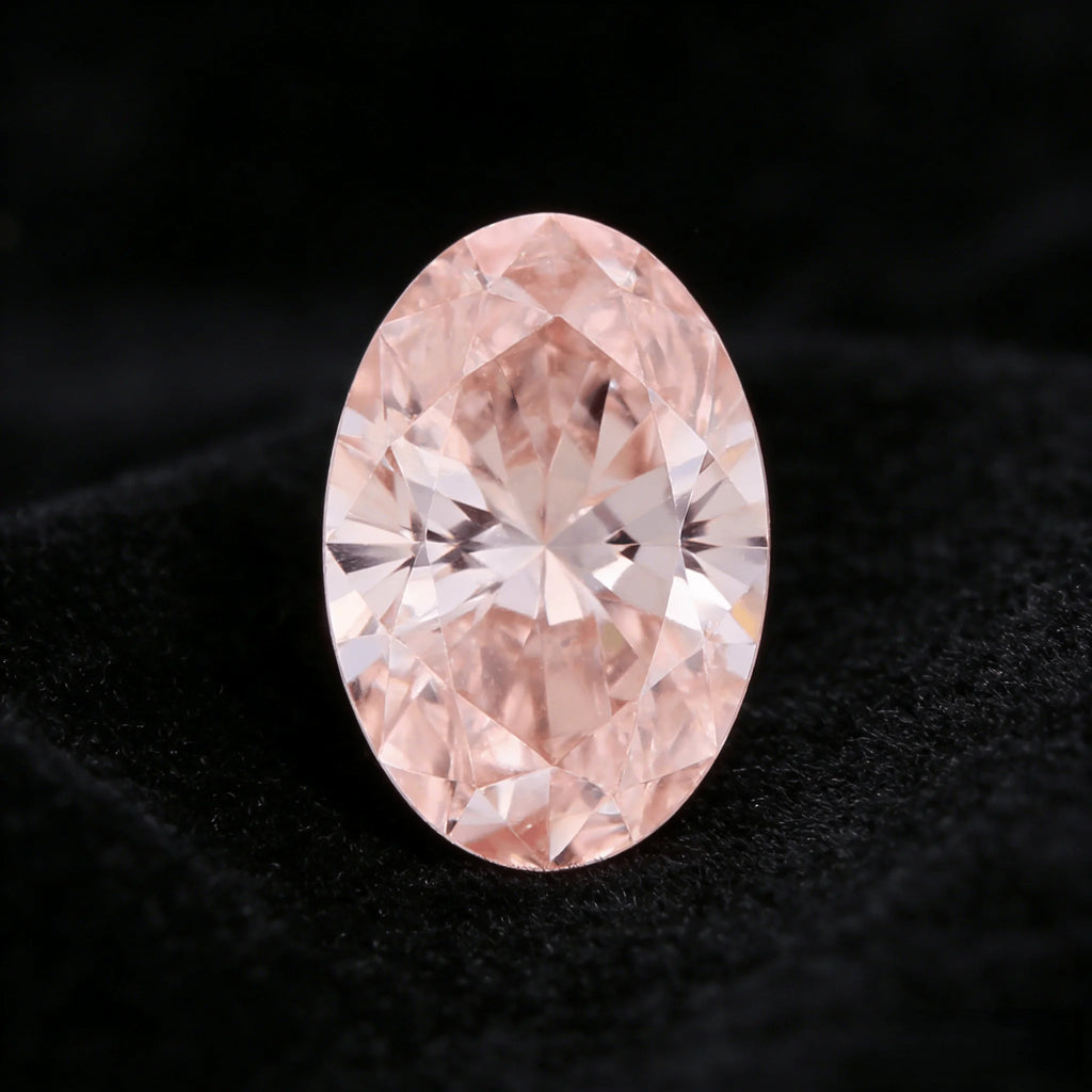 Oval fancy pink lab-grown diamond with detailed facets and bright sparkle