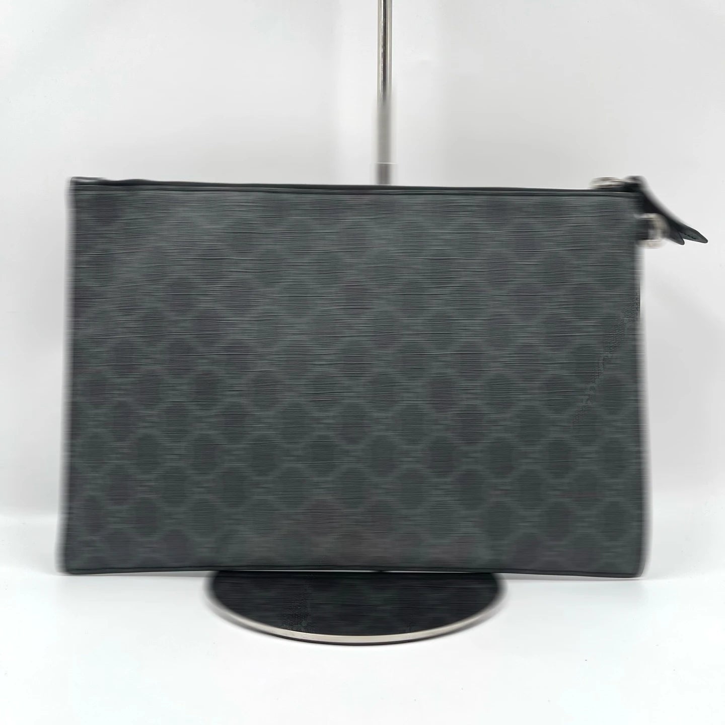 Designer charcoal grey canvas clutch wallet with repeating monogram pattern and zip closure. Unisex handheld bag.