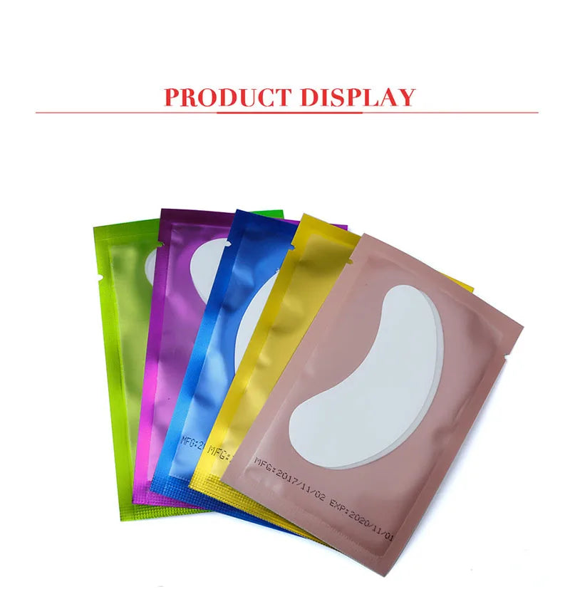 Multicolor metallic foil pouches containing white gel under-eye lash extension pads for beauty and lash artists.