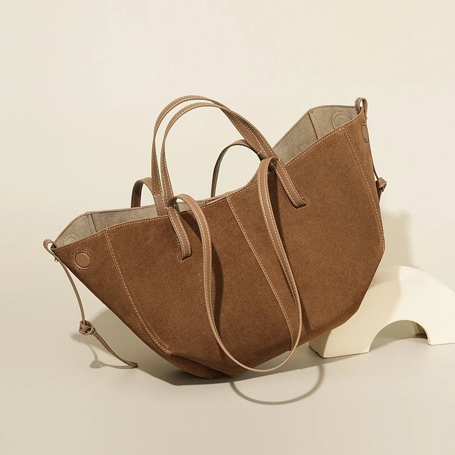 Large capacity brown suede designer tote bag with thin shoulder straps and contrast stitching for women.