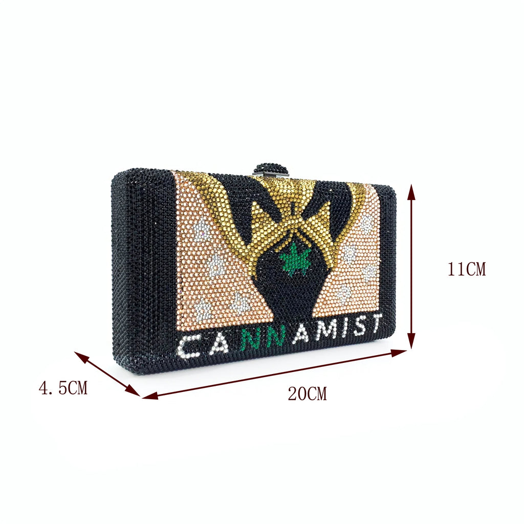 Black crystal evening clutch with gold and green Cannamist design, hard-shell designer handbag for formal occasions.