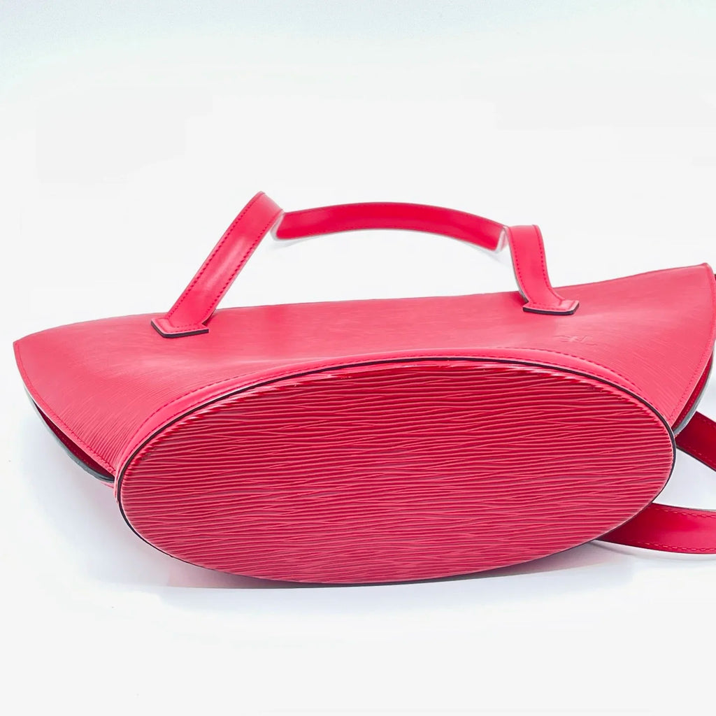Luxury red genuine leather designer shoulder bag with classic water ripple texture and oval base.