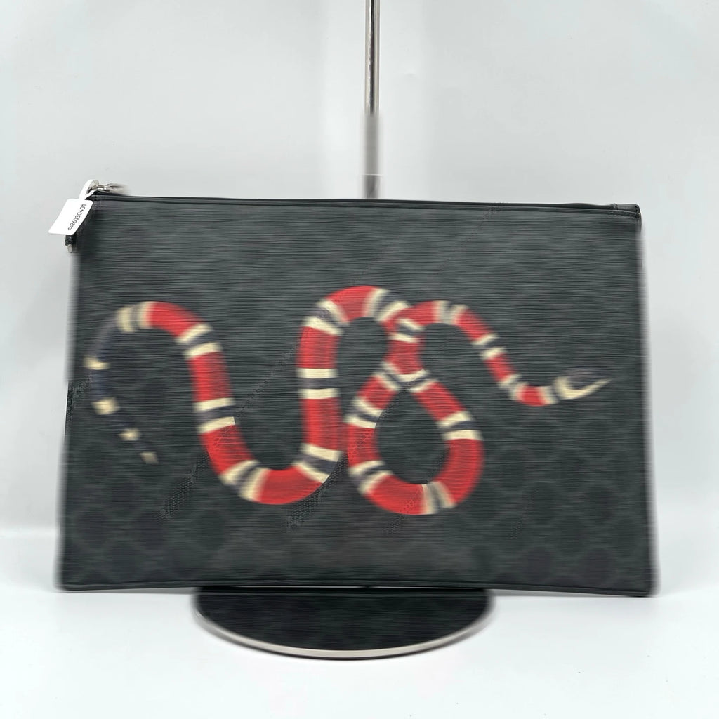 Second-hand designer black canvas clutch wallet featuring a stylish red, white, and black snake print, unisex style.