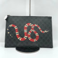 Second-hand designer black canvas clutch wallet featuring a stylish red, white, and black snake print, unisex style.