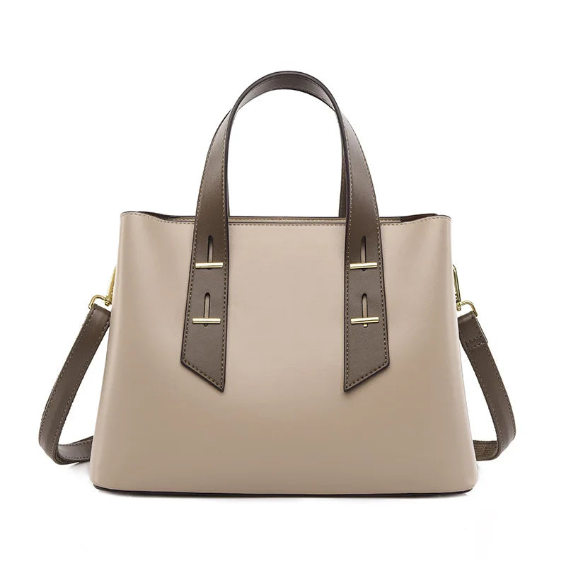 Taupe and brown designer shoulder bag with two-tone leather, gold hardware accents, and detachable crossbody strap.