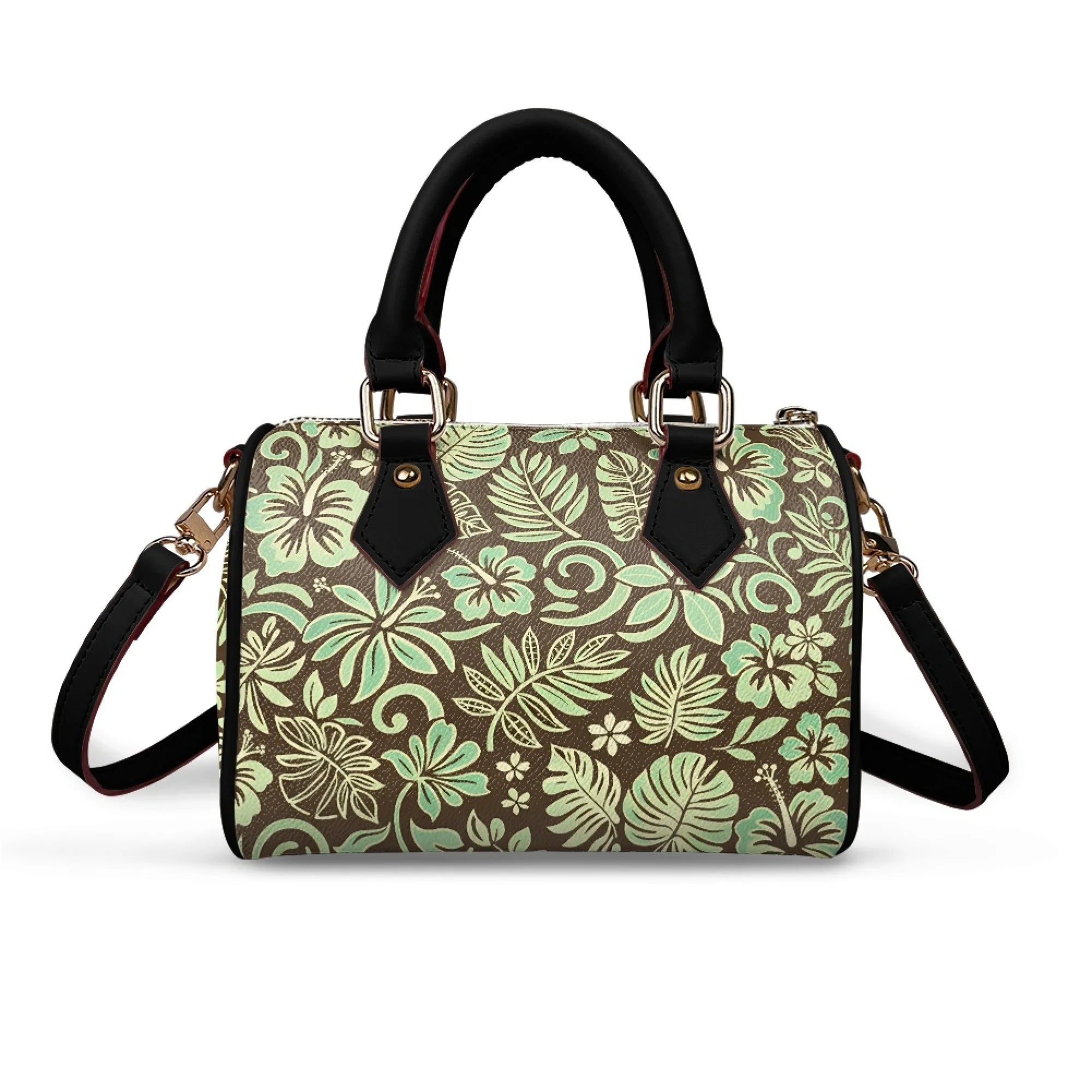 Pillow-shaped handbag with brown and mint green tropical floral print, black handles, and detachable shoulder strap.