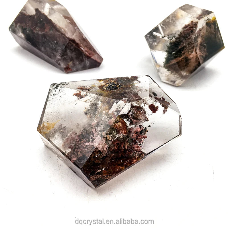 Polished dark quartz free-form crystal with reflective facets and reddish mineral inclusions