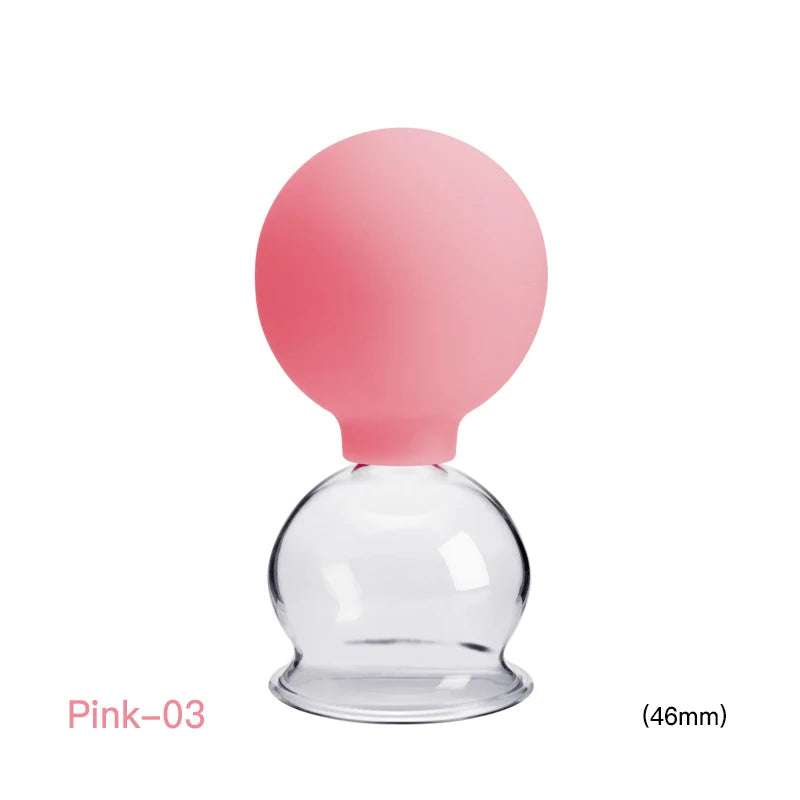 A 46mm pink silicone and clear glass vacuum cupping massage tool for therapy and skin lifting.