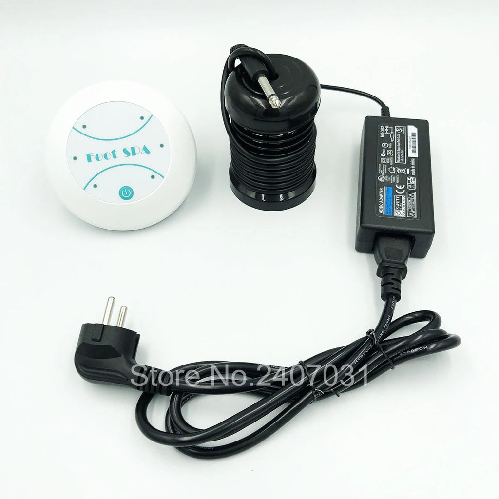 Electric detox ion foot spa machine with control unit, black round array, power adapter, and plug on white background.