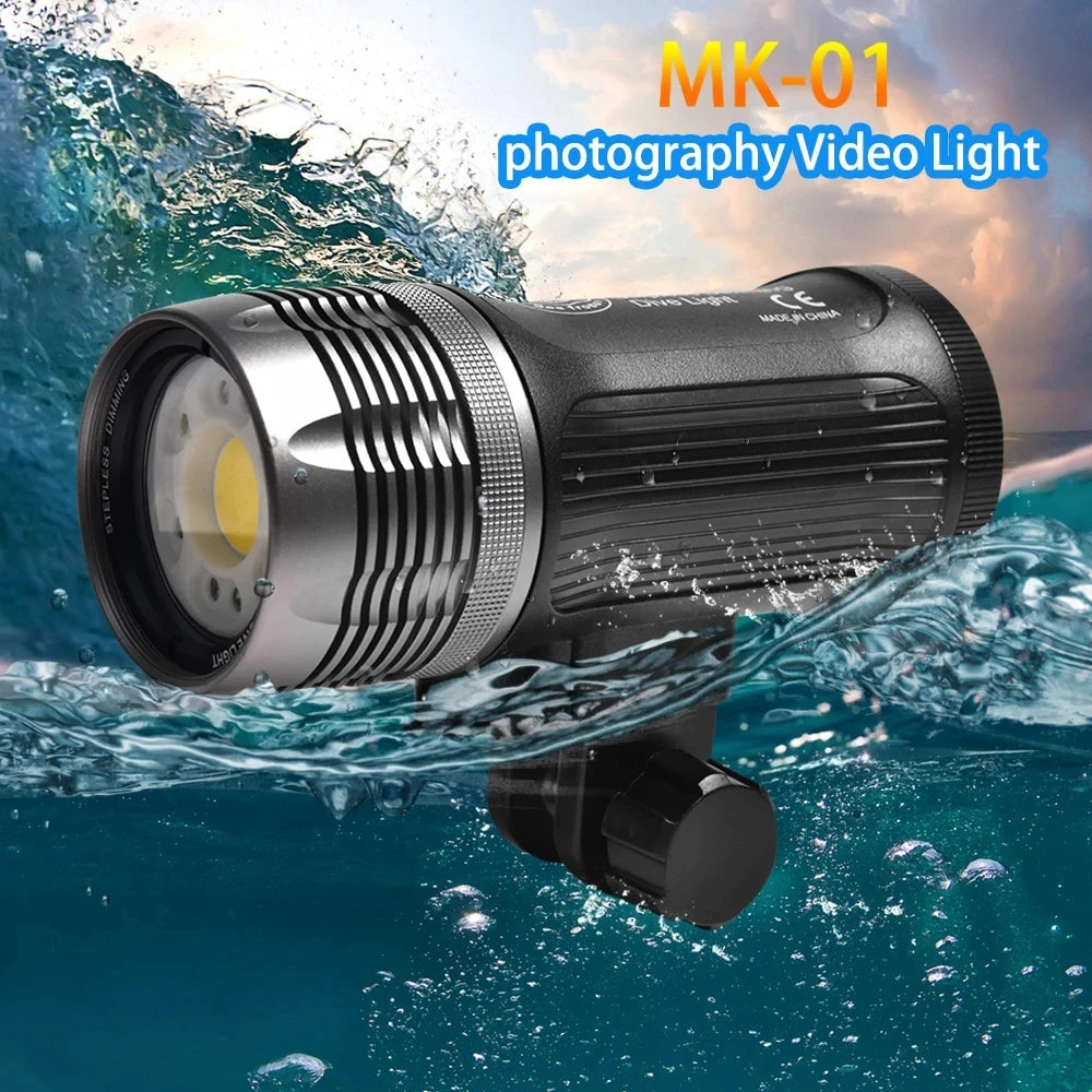MK-01 waterproof LED video light with a black aluminum cylindrical body, partially submerged in ocean waves.