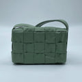 Pre-owned light green leather woven designer shoulder bag with a structured rectangular shape and wide braided detail.